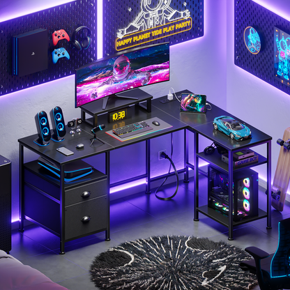 Furologee 50 Inch L Shaped Gaming Desk with Power Outlets, Computer Desk with Storage Shelves & Drawers & Monitor Stand, Reversible Gaming Table for Bedroom and Home Office, Black